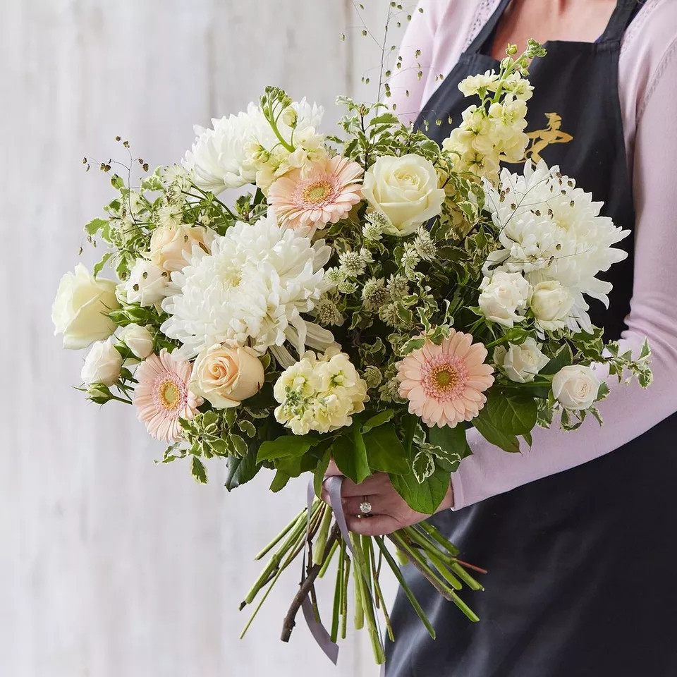 Sympathy hand-tied made with beautiful fresh flowers